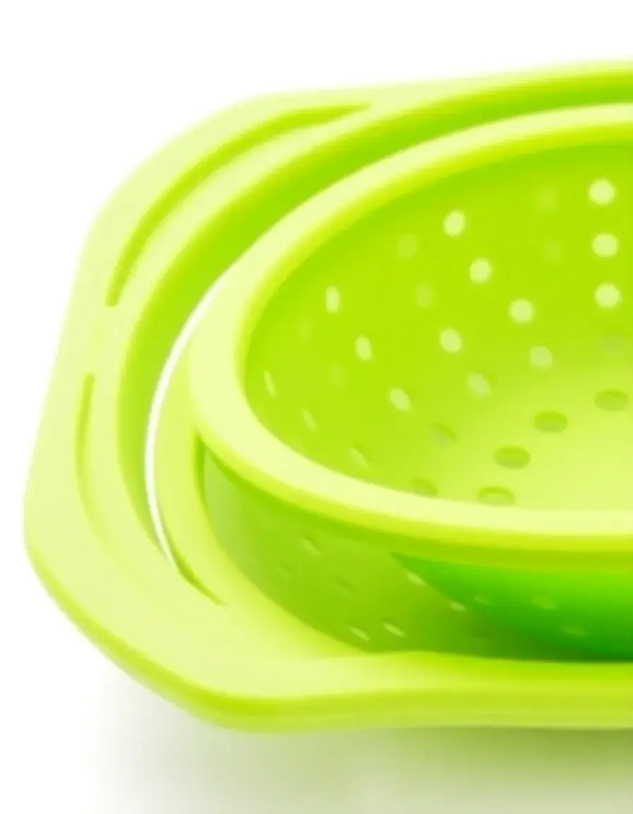 Green silicone folding colander for washing vegetables, space saving design