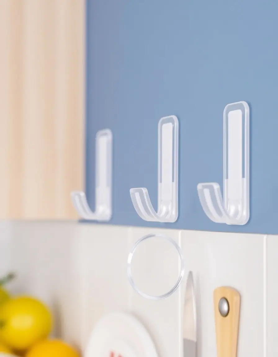 Ganci adesivi trasparenti per utensili da cucina